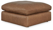 Emilia oversized accent ottoman by Ashley Furniture featuring a plush fabric surface and stylish design.
