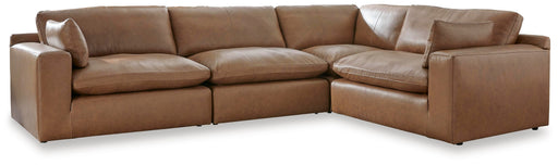 Ashley Furniture Emilia Sectional with plush cushions and modern design, shown in a cozy living room setting.