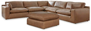 Ashley Furniture Emilia living room set with plush sofa, loveseat, and coffee table in a modern design.