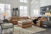 Ashley Furniture Emilia living room set featuring a sofa and armchair with neutral fabric upholstery and modern design.