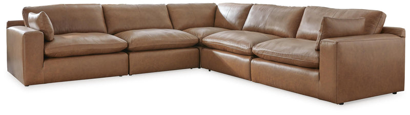 Ashley Furniture Emilia sectional sofa with plush cushions and modern design, shown in a cozy, stylish living room setting.