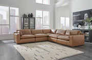 Ashley Furniture Emilia Sectional sofa with plush cushions and modern design, shown in a stylish living room setting.