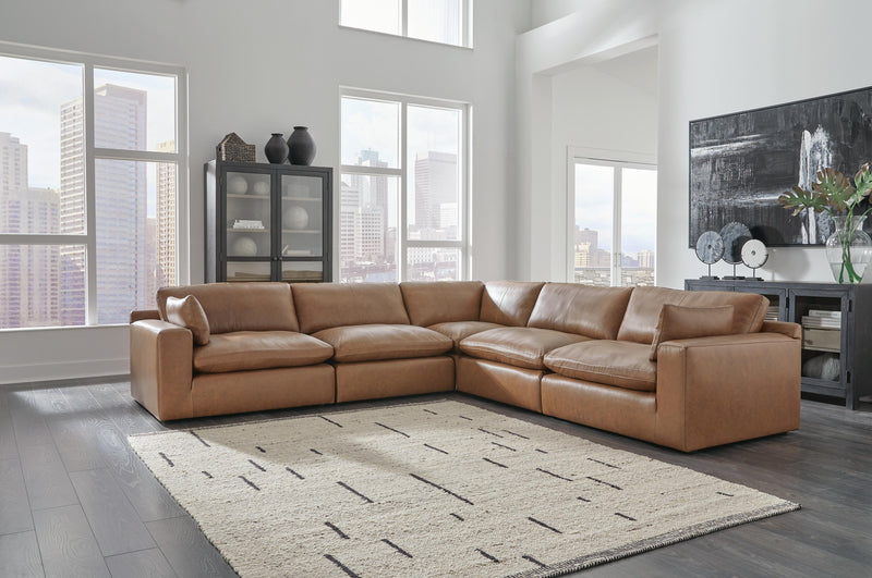 Ashley Furniture Emilia Sectional sofa with plush cushions and modern design, shown in a stylish living room setting.