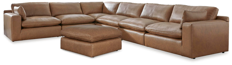 Ashley Furniture Emilia living room set with sofa and armchair in a modern design, shown in a cozy, stylish living space.