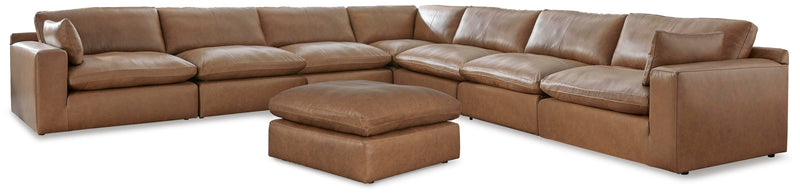 Ashley Furniture Emilia living room set with sofa and armchair in a cozy, modern design, shown in a neutral fabric.