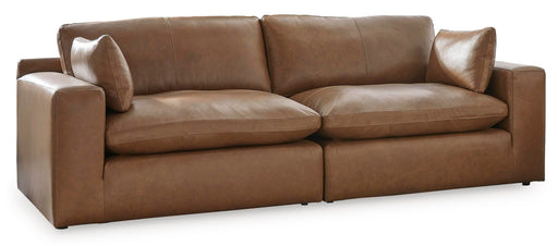 Ashley Furniture Emilia sectional loveseat with plush cushions and neutral fabric, showing a cozy modern living room setup.