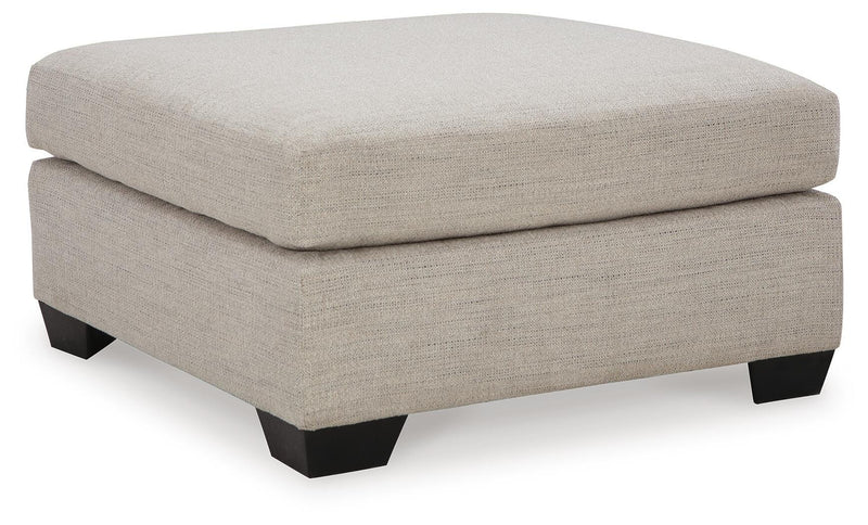 Ashley Furniture Mahoney living room set with plush sofa and matching chairs, arranged in a modern, cozy living space.