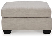 Ashley Furniture Mahoney living room set with sofa and armchair in a modern, comfortable design, shown from the side angle.