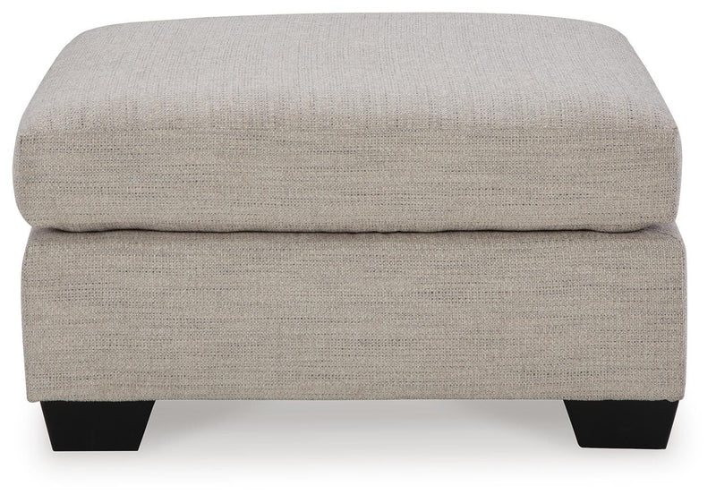 Ashley Furniture Mahoney living room set with sofa and armchair in a modern, comfortable design, shown from the side angle.