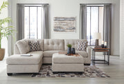 Ashley Furniture Mahoney living room set featuring a sofa and armchair with neutral upholstery and modern design.