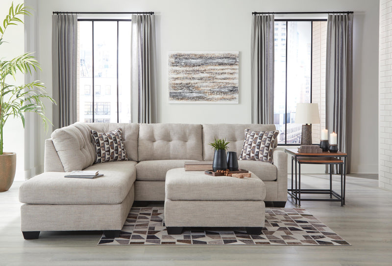 Ashley Furniture Mahoney living room set featuring a sofa and armchair with neutral upholstery and modern design.