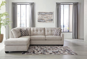 Ashley Furniture Mahoney living room set featuring a sofa and loveseat with plush cushions and neutral upholstery.