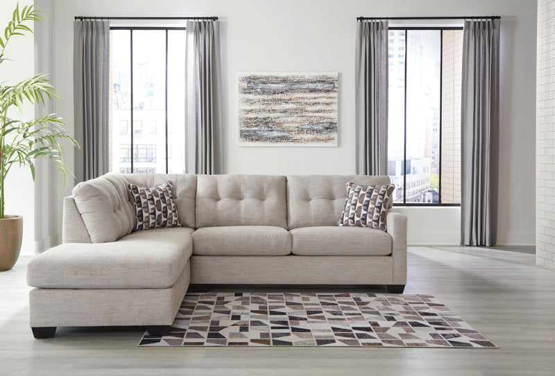 Ashley Furniture Mahoney living room set featuring a sofa and loveseat with plush cushions and neutral upholstery.