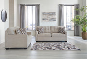 Ashley Furniture Mahoney living room set with sofa and armchair, featuring neutral upholstery and modern design.