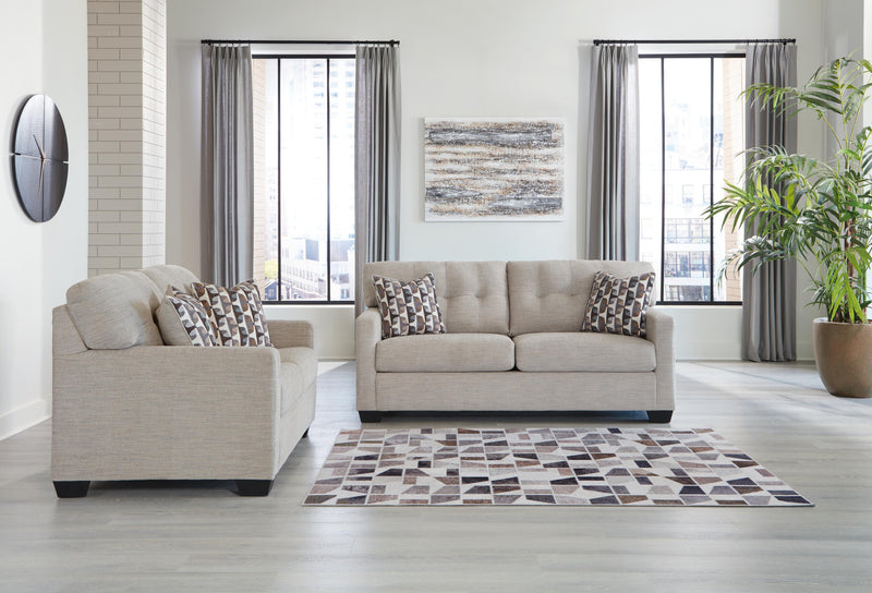 Ashley Furniture Mahoney living room set with sofa and armchair, featuring neutral upholstery and modern design.