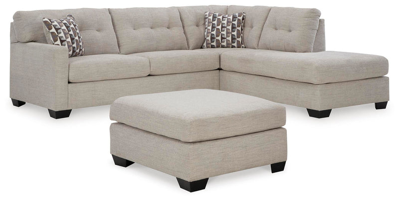 Ashley Furniture Mahoney living room set with sofa, loveseat, and armchair in a cozy, modern design, shown in a well-lit room setting.