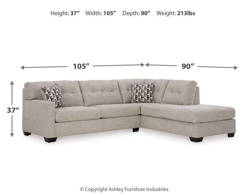 Ashley Furniture Mahoney living room set featuring a sofa, loveseat, and armchair with neutral upholstery and wooden legs.