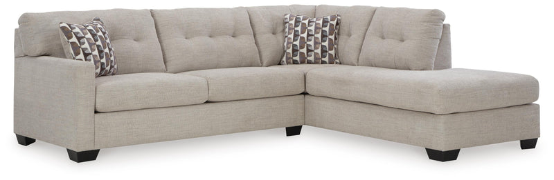 Ashley Furniture Mahoney living room set with sofa and armchair, featuring neutral fabric upholstery and modern design.
