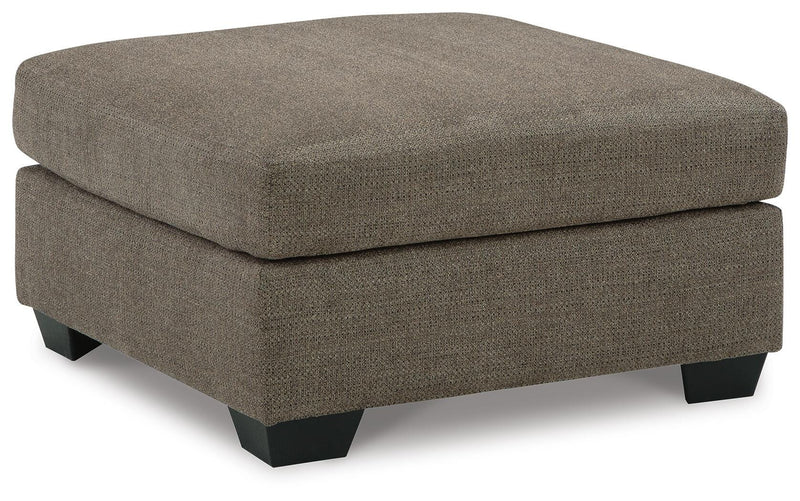 Ashley Furniture Mahoney living room set featuring a sofa, loveseat, and armchair with neutral fabric upholstery in a modern style.