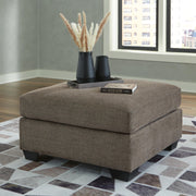 Ashley Furniture Mahoney living room set with sofa and armchair in a modern design, featuring neutral upholstery and stylish cushions.