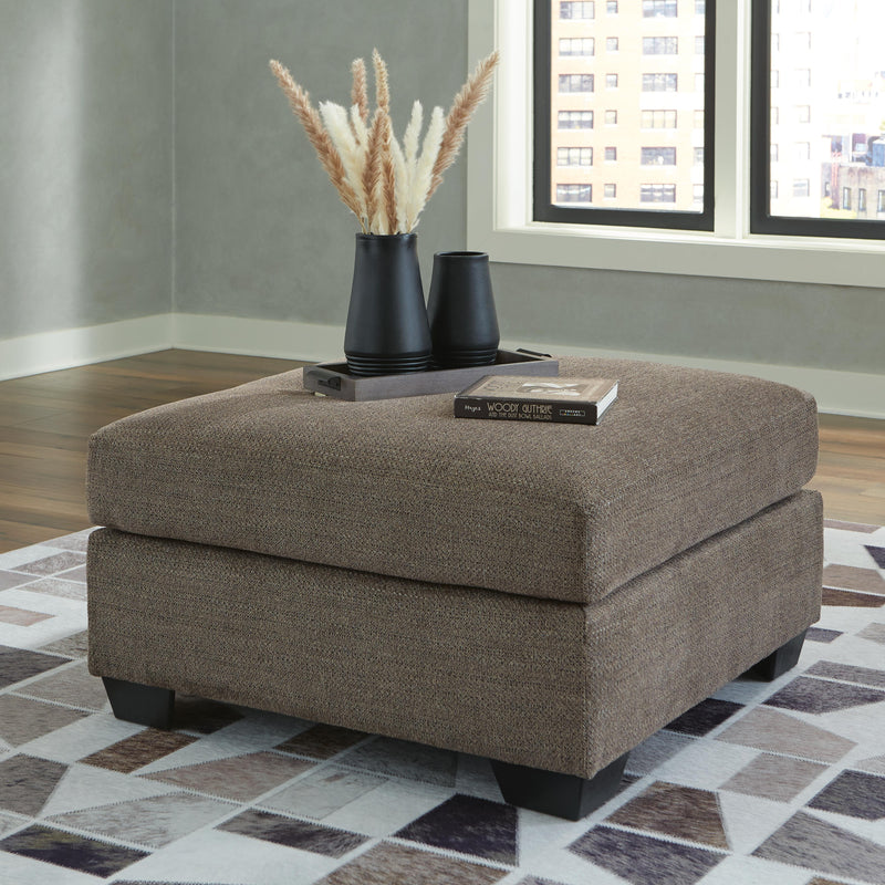 Ashley Furniture Mahoney living room set with sofa and armchair in a modern design, featuring neutral upholstery and stylish cushions.