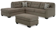 Ashley Furniture Mahoney living room set with sofa and armchair, upholstered in neutral fabric, in a modern home setting.