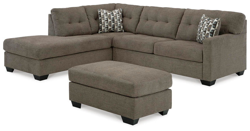 Ashley Furniture Mahoney living room set with sofa and armchair, upholstered in neutral fabric, in a modern home setting.