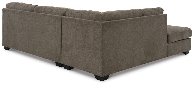 Ashley Furniture Mahoney living room set with sofa and loveseat, featuring plush cushions and coordinated fabric.