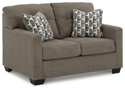 Ashley Furniture Mahoney living room set with sofa and armchair, featuring neutral upholstery and modern design.