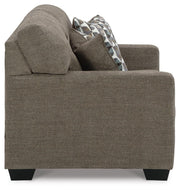 Ashley Furniture Mahoney living room set with sofa and armchair, featuring neutral upholstery and modern design.