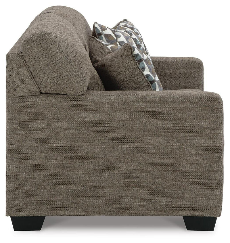 Ashley Furniture Mahoney living room set with sofa and armchair, featuring neutral upholstery and modern design.