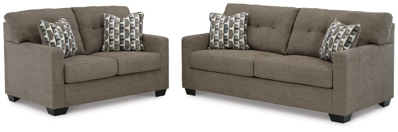 Ashley Furniture Mahoney living room set featuring a sofa and matching armchair with neutral fabric upholstery.
