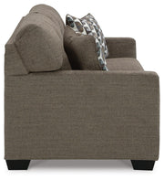 Ashley Furniture Mahoney living room set featuring a sectional sofa and coordinating chairs in a modern design.