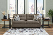 Ashley Furniture Mahoney living room set with plush sofa and matching armchair, featuring neutral fabric and modern design.