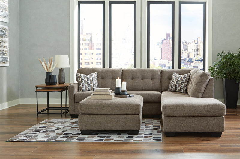 Ashley Furniture Mahoney living room set featuring a sofa and loveseat with plush cushions and neutral upholstery.