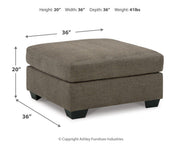 Ashley Furniture Mahoney living room set featuring a sofa and armchair with neutral upholstery and modern design.