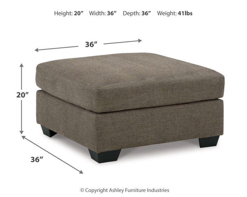 Ashley Furniture Mahoney living room set featuring a sofa and armchair with neutral upholstery and modern design.