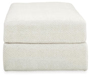 Ashley Furniture Karinne oversized accent ottoman with soft fabric upholstery, featuring a plush, rectangular design for stylish comfort.