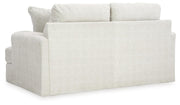 Ashley Furniture Karinne Loveseat with plush cushions and stylish fabric, perfect for cozy living room seating.
