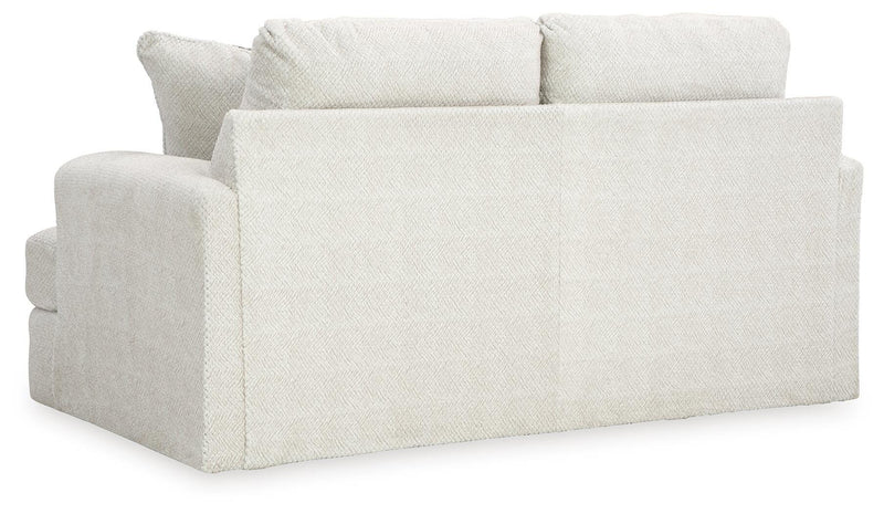 Ashley Furniture Karinne Loveseat with plush cushions and stylish fabric, perfect for cozy living room seating.