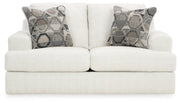 Ashley Furniture Karinne Loveseat with plush fabric and cushioned backrest, shown from a head-on view.