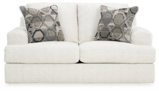 Ashley Furniture Karinne Loveseat with plush fabric and cushioned backrest, shown from a head-on view.
