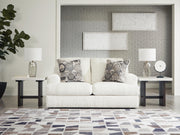 Ashley Furniture Karinne Loveseat with plush fabric and modern design, featuring cushioned seats and stylish armrests.