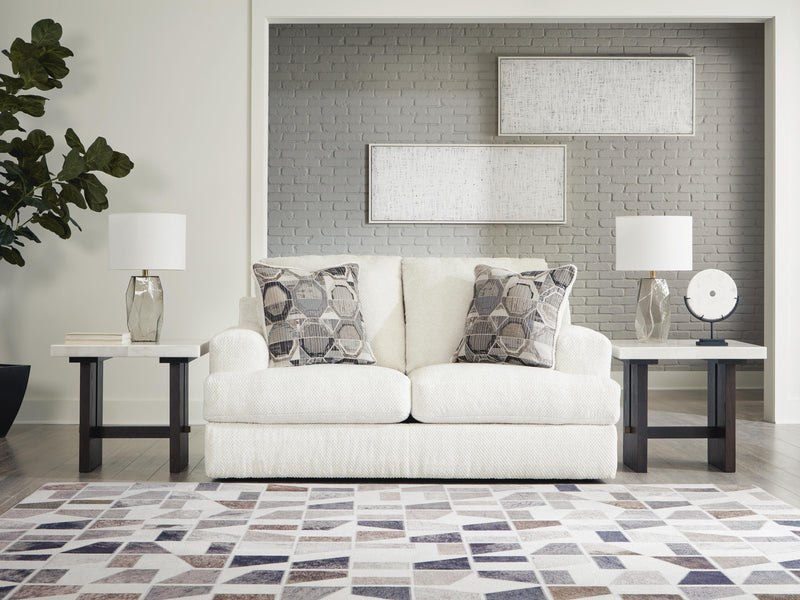 Ashley Furniture Karinne Loveseat with plush fabric and modern design, featuring cushioned seats and stylish armrests.