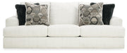 Ashley Furniture Karinne Sofa with plush cushions and neutral fabric, shown from the front view.