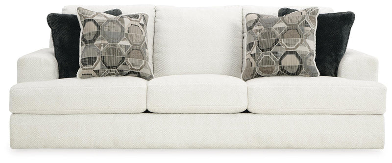 Ashley Furniture Karinne Sofa with plush cushions and neutral fabric, shown from the front view.