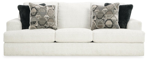 Ashley Furniture Karinne Sofa with plush cushions and neutral fabric, shown from the front view.