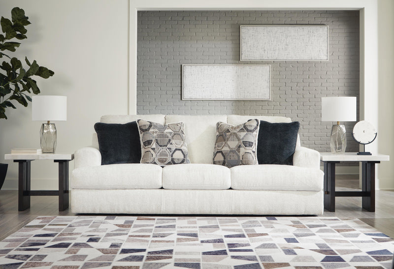 Ashley Furniture Karinne Sofa with plush fabric and modern design, featuring clean lines and comfortable seating.