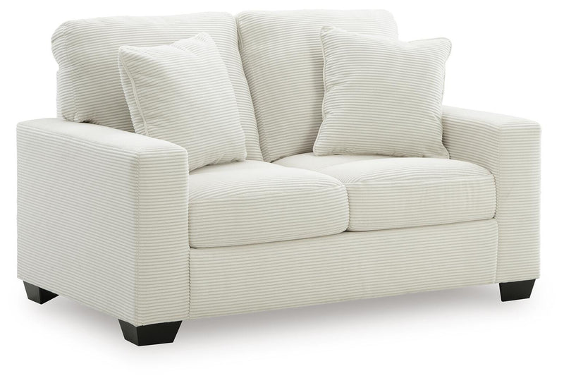 Ashley Furniture Greenbriar living room set with a sofa and matching chairs, upholstered in neutral fabric with wood accents.