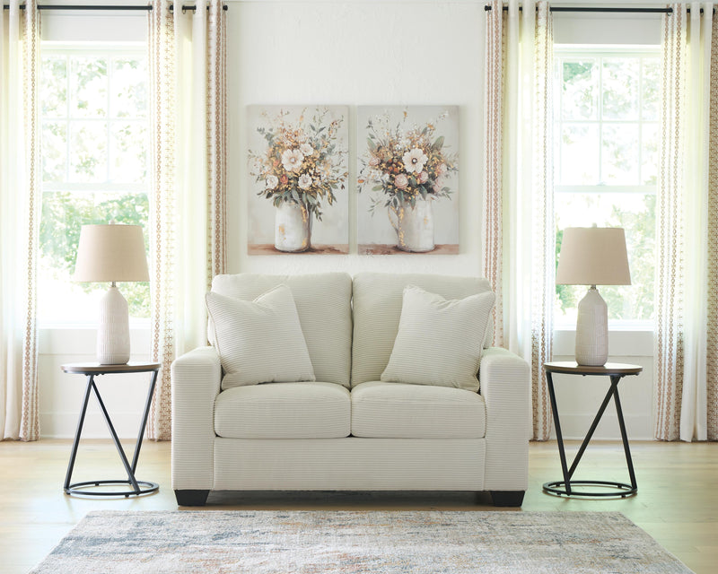 Ashley Furniture Greenbriar living room set with sofa and armchair, featuring plush upholstery and classic design.